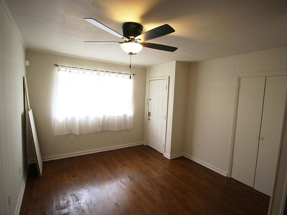 Bedroom with a window and a double closet